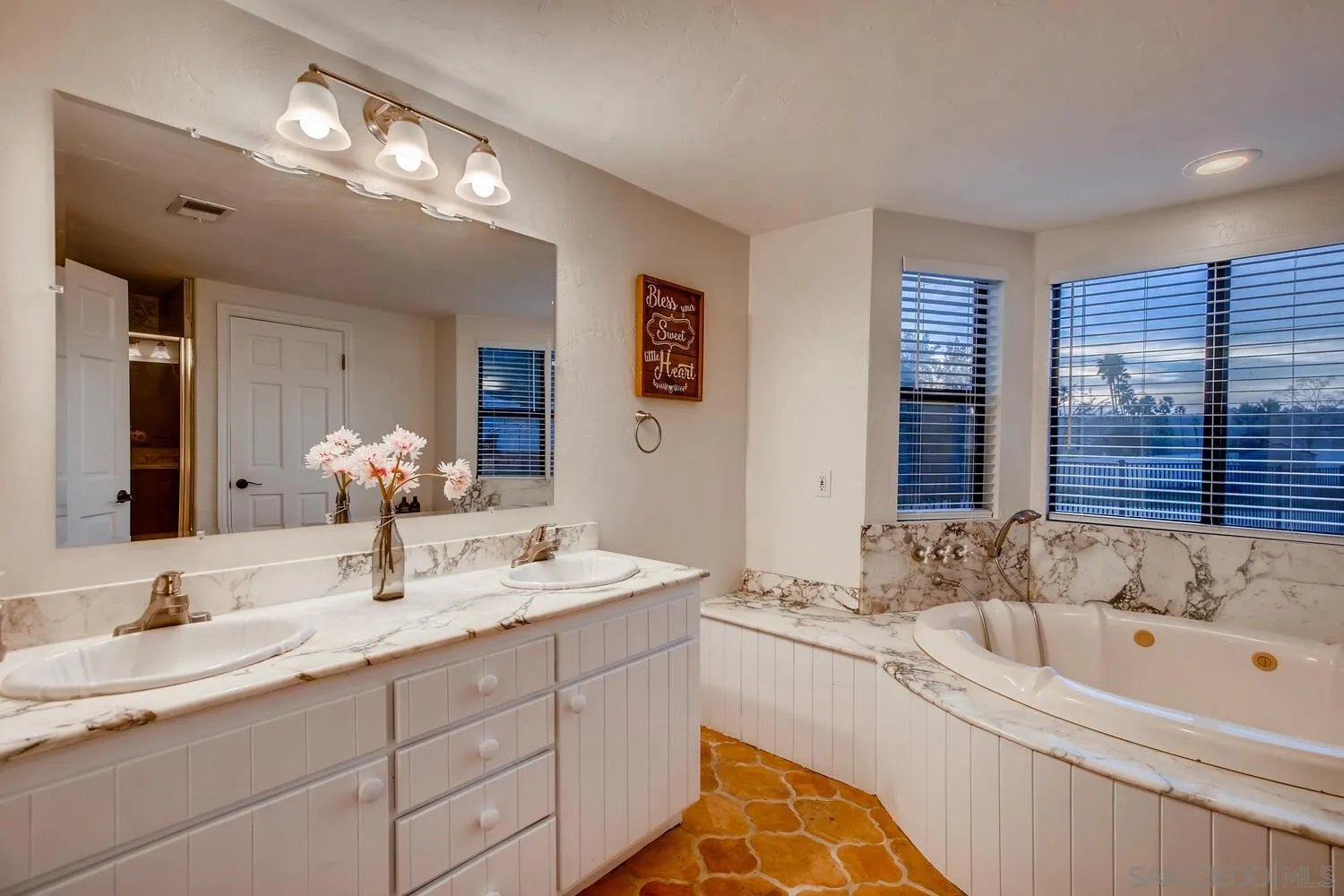 13992 Putney Road Poway, CA 92064 - Photo 20 of 38 a bathroom with a sink double vanity granite tub and a mirror