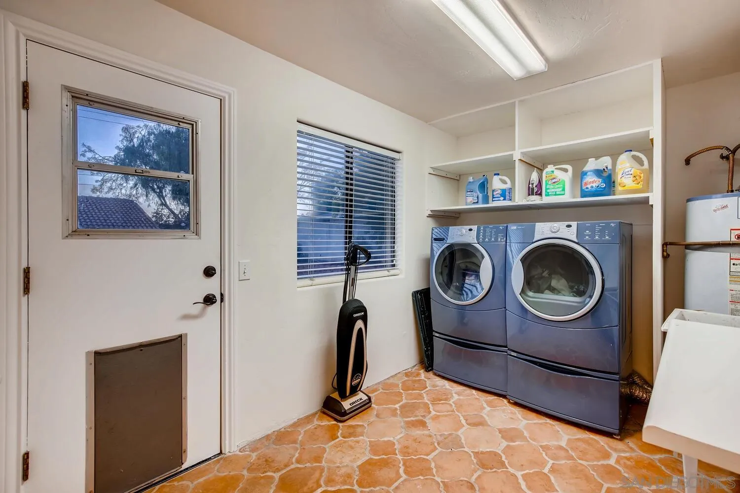 13992 Putney Road Poway, CA 92064 - Photo 32 of 38 a view of living room with washer and dryer