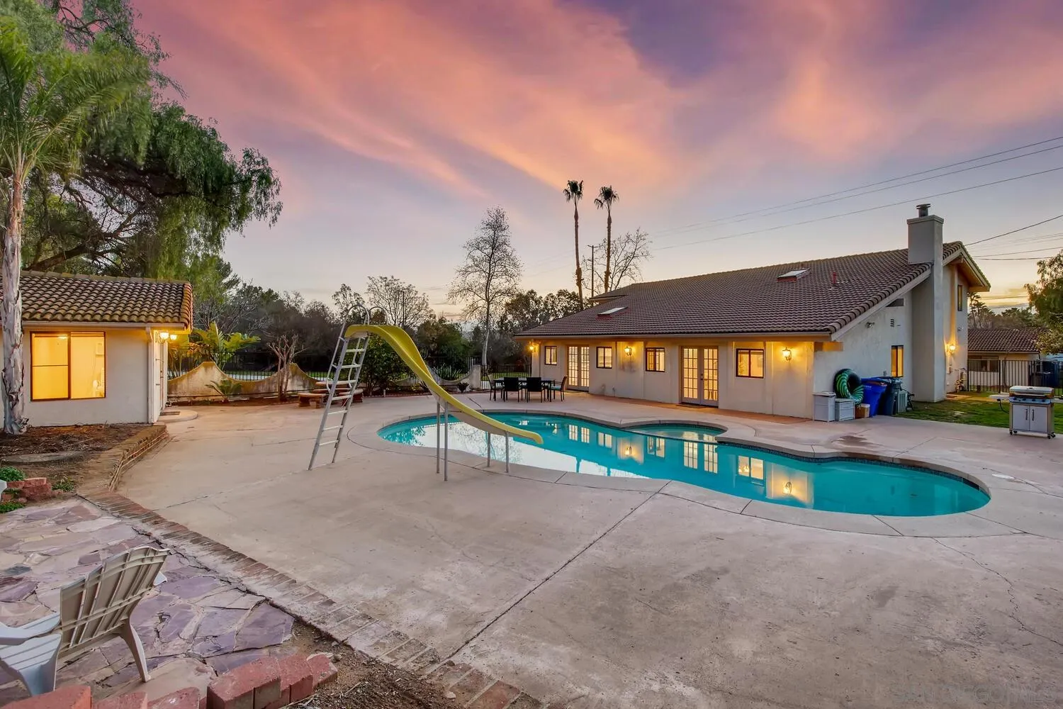 13992 Putney Road Poway, CA 92064 - Photo 34 of 38 a view of a house with swimming pool and sitting area