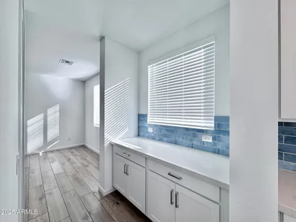 a bathroom with a sink a mirror and a window