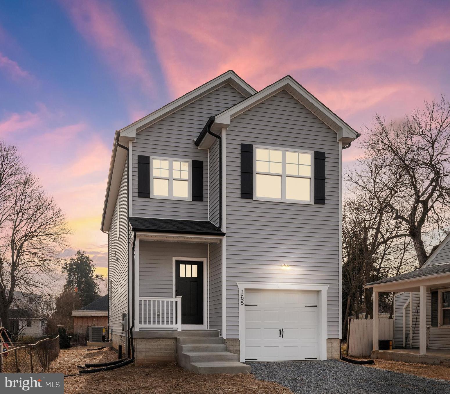 a front view of a house with a garage