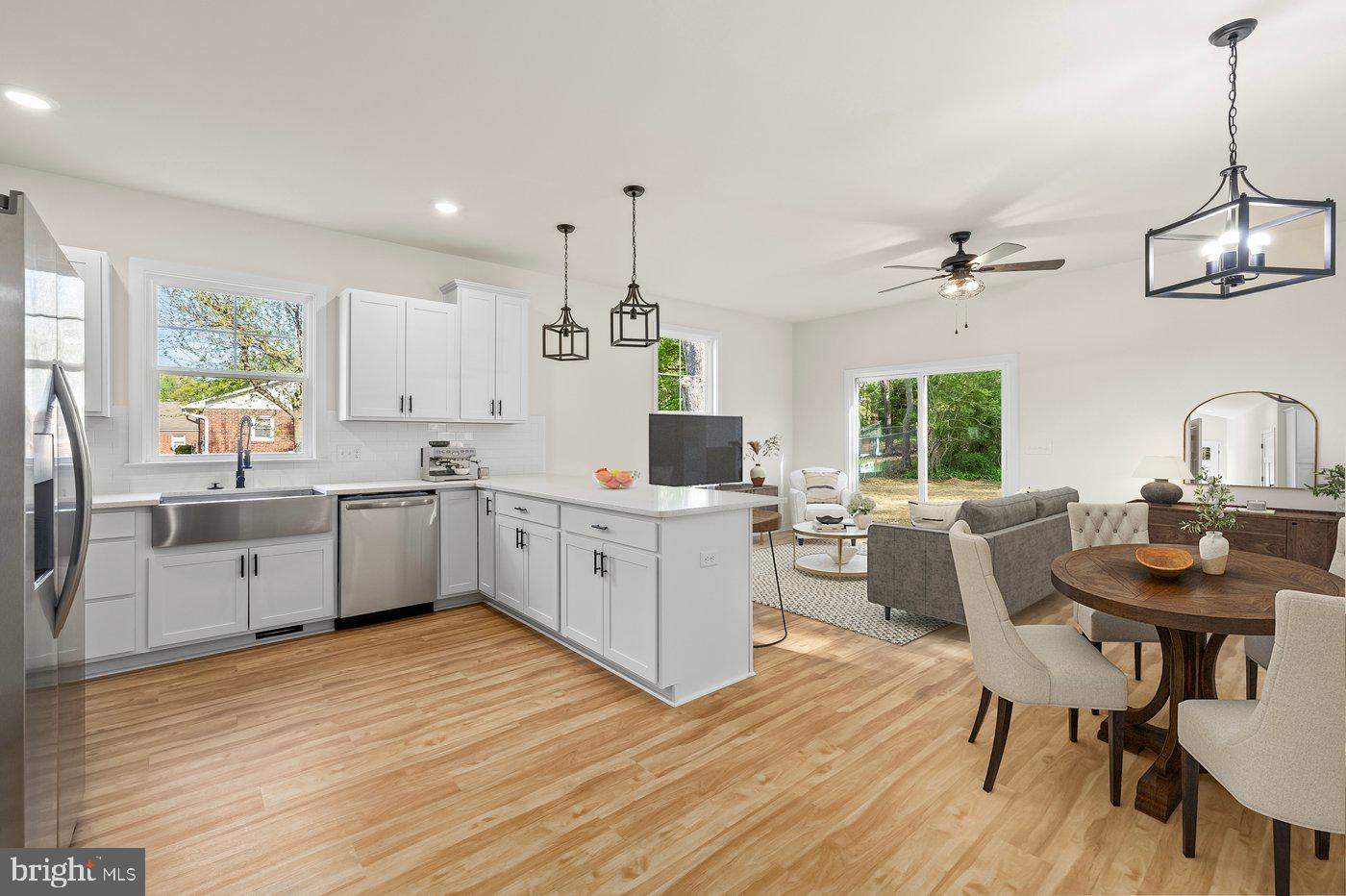 165 Bend Farm Road Fredericksburg, VA 22408 - Photo 2 of 49 a kitchen with a table chairs sink and cabinets
