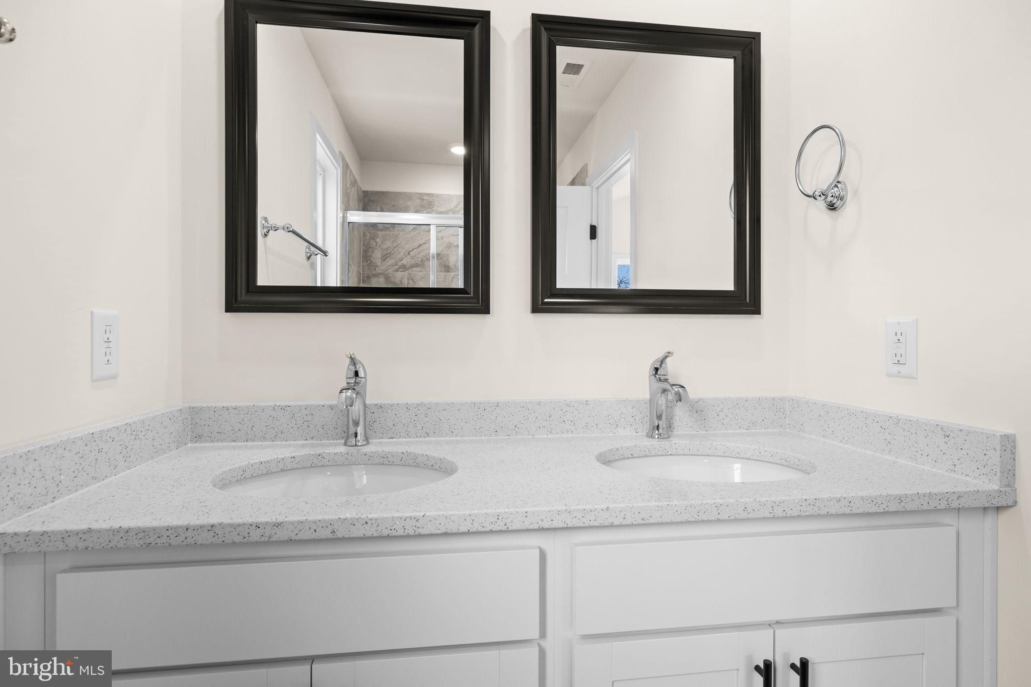 165 Bend Farm Road Fredericksburg, VA 22408 - Photo 33 of 49 a bathroom with double vanity sinks and a mirror