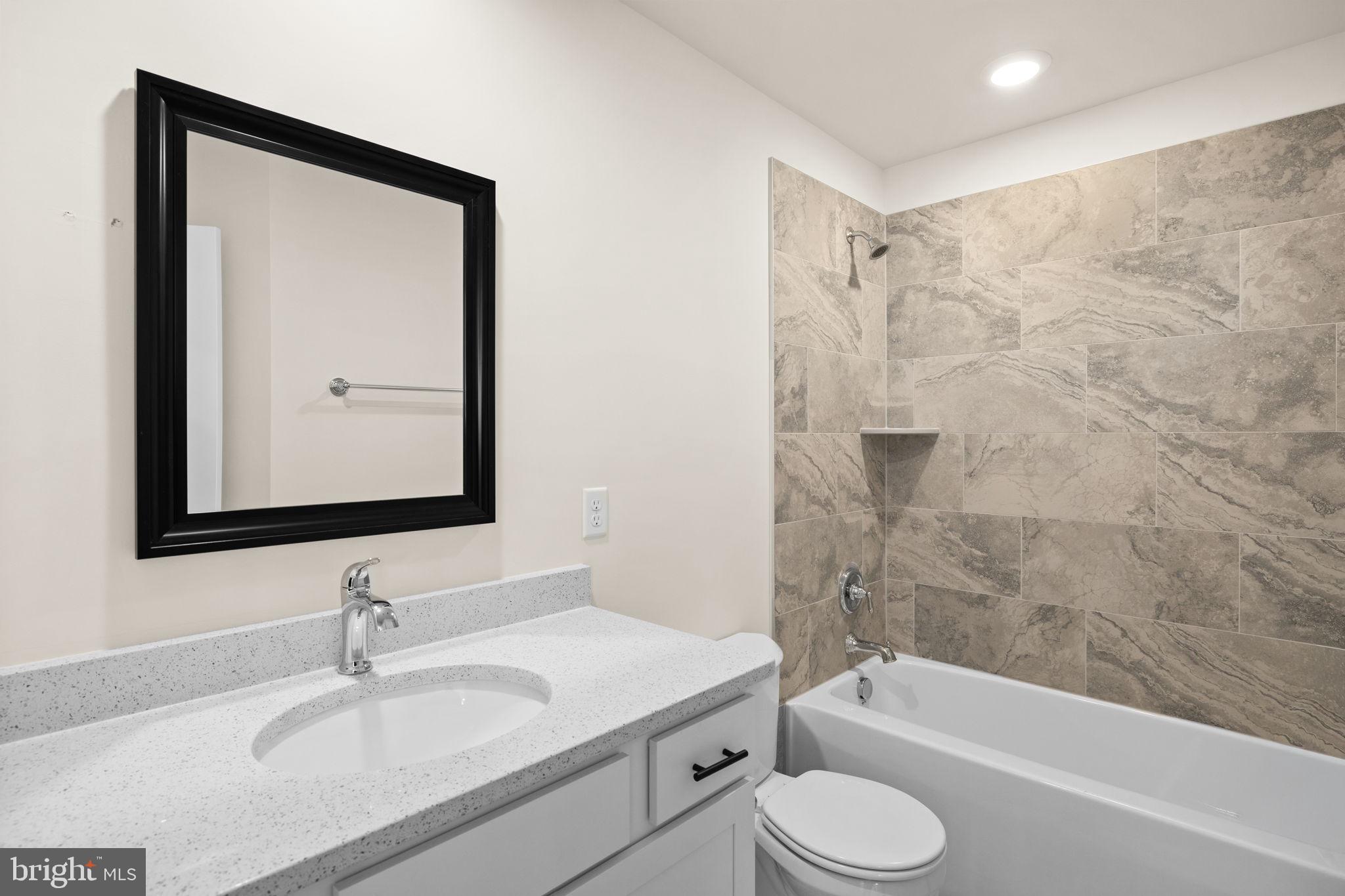 165 Bend Farm Road Fredericksburg, VA 22408 - Photo 38 of 49 a bathroom with a granite countertop sink toilet and shower