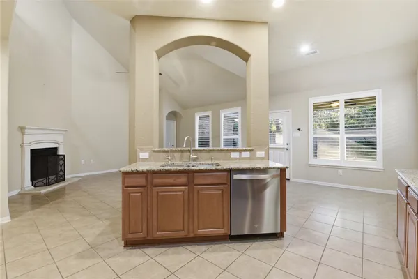 a view of a kitchen with a sink and a stove top oven