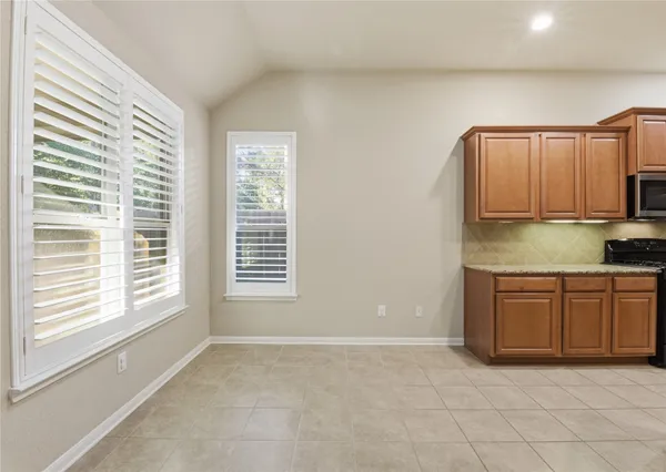 a view of a kitchen with granite countertop cabinets and a sink