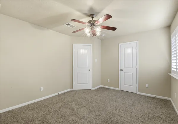 a view of a chandelier fan in a room