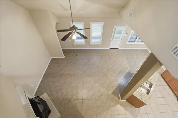 a view of a living room with furniture and floor