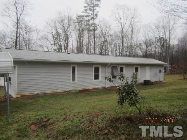 517 James Long Road Roxboro, NC 27574 - Photo 2 of 16 a view of a house with a yard