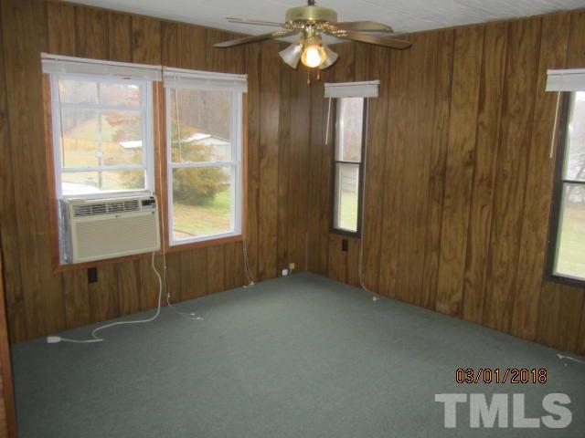 517 James Long Road Roxboro, NC 27574 - Photo 12 of 16 a view of an empty room with a window