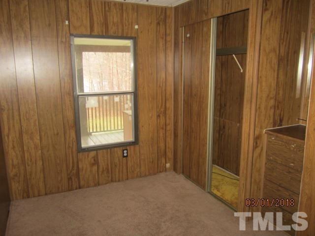 517 James Long Road Roxboro, NC 27574 - Photo 14 of 16 a view of an empty room with a window
