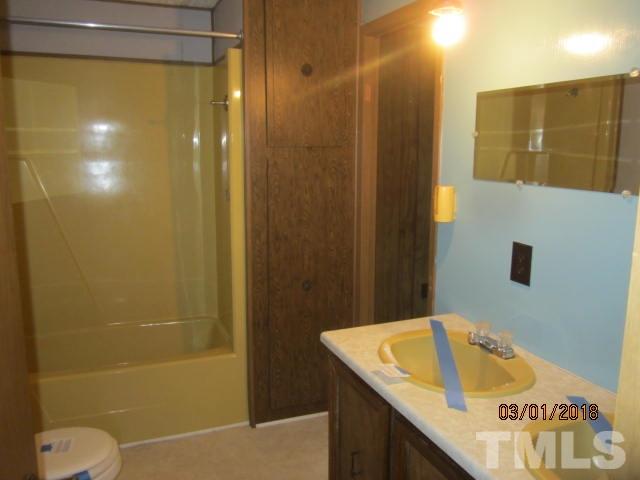 517 James Long Road Roxboro, NC 27574 - Photo 15 of 16 a bathroom with a sink and a shower