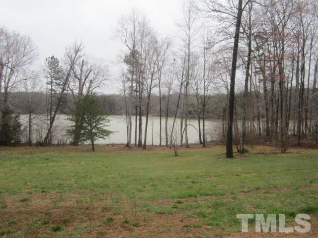 517 James Long Road Roxboro, NC 27574 - Photo 4 of 16 a view of a yard with a trees