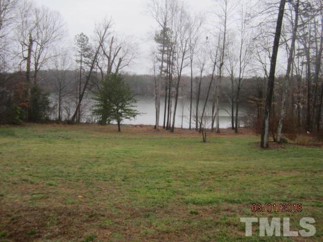 517 James Long Road Roxboro, NC 27574 - Photo 8 of 16 a view of outdoor space with deck and yard
