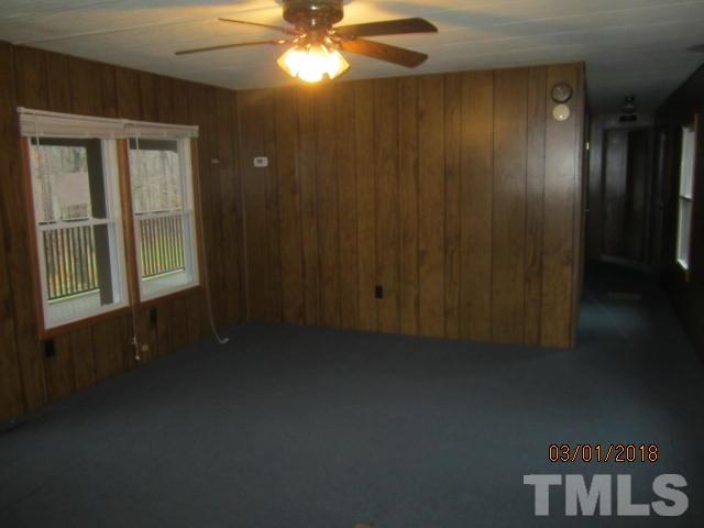 517 James Long Road Roxboro, NC 27574 - Photo 9 of 16 a view of an empty room and a window