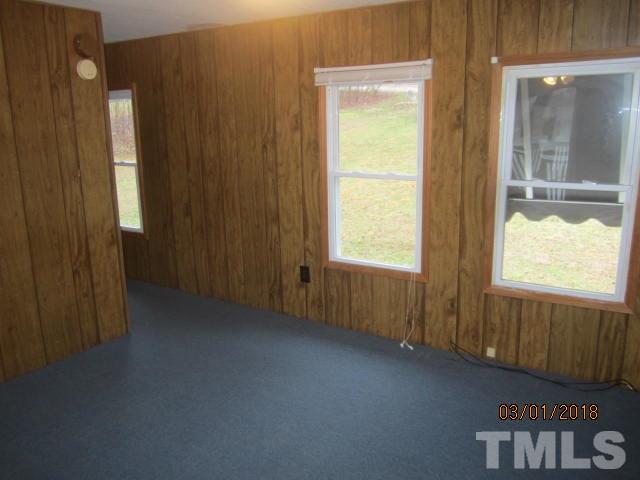517 James Long Road Roxboro, NC 27574 - Photo 10 of 16 a view of an empty room and window