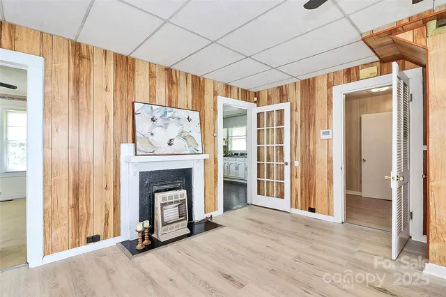 a view of a livingroom with a fireplace and cabinet