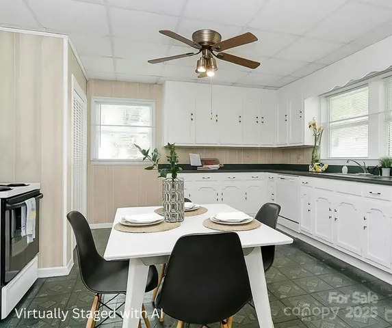 a dining room with furniture and window