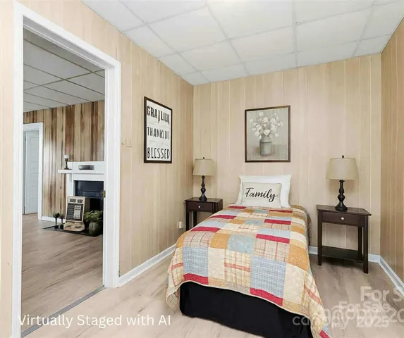 a bedroom with a bed and a view of bedroom