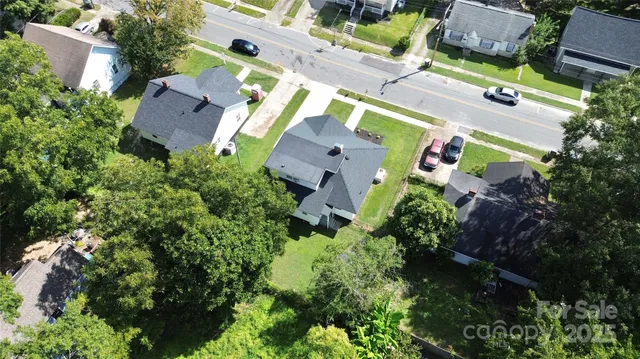 an aerial view of houses with yard