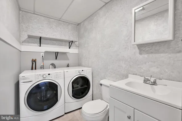 a utility room with dryer and washer