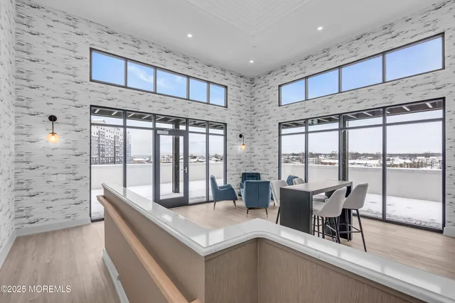 a view of kitchen with furniture and a wooden floor
