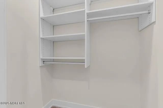 a view of an empty walk in closet