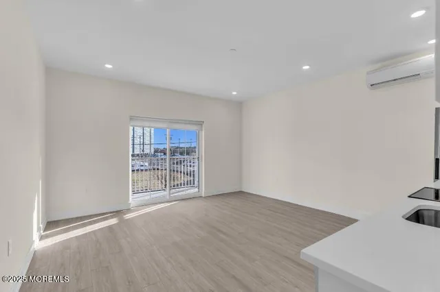 a view of kitchen with granite countertop cabinets and white appliances