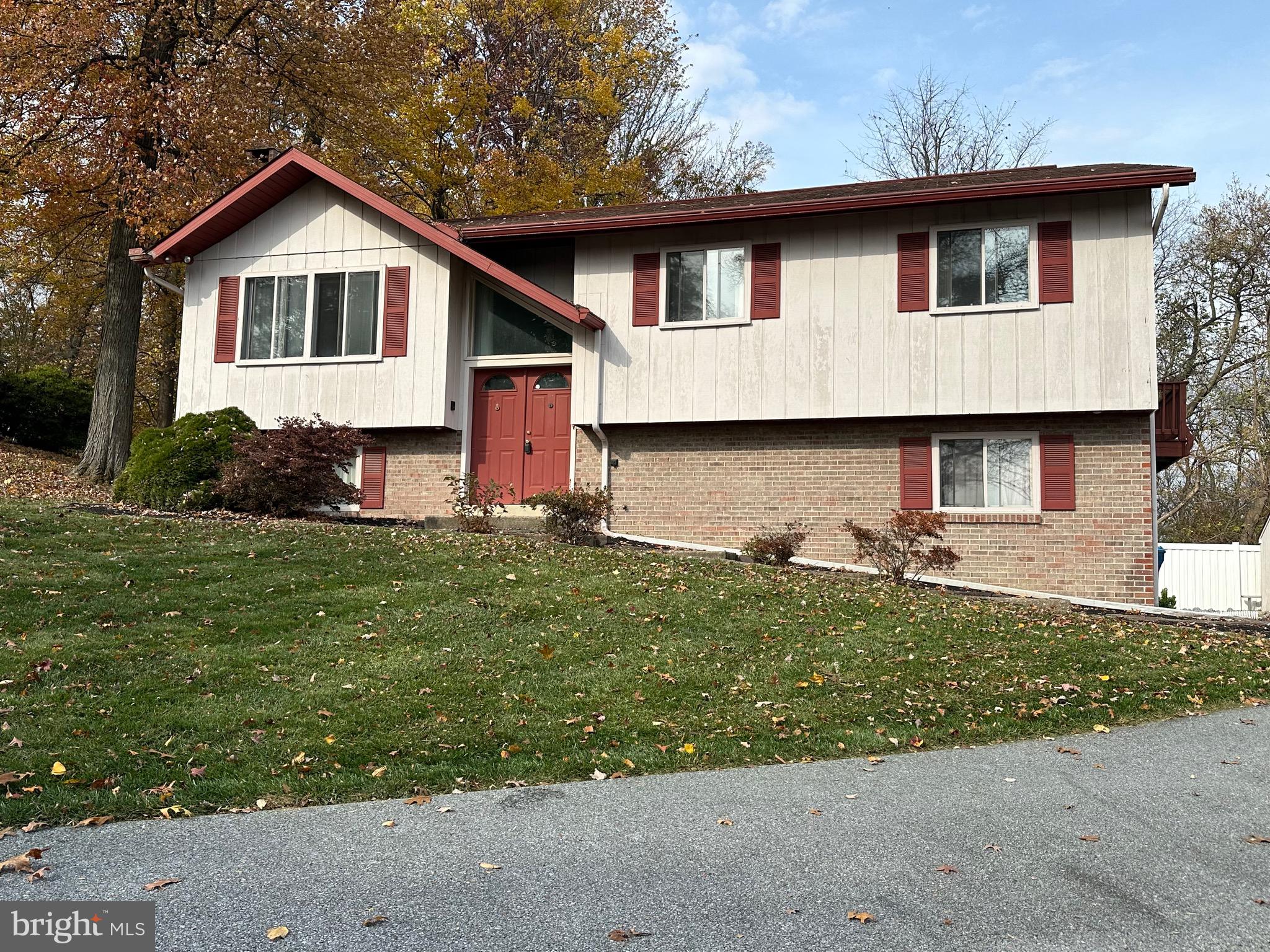 2776 Stevens Summit Drive Columbia, PA 17512 - Photo 1 of 39 a front view of a house with a yard and garage