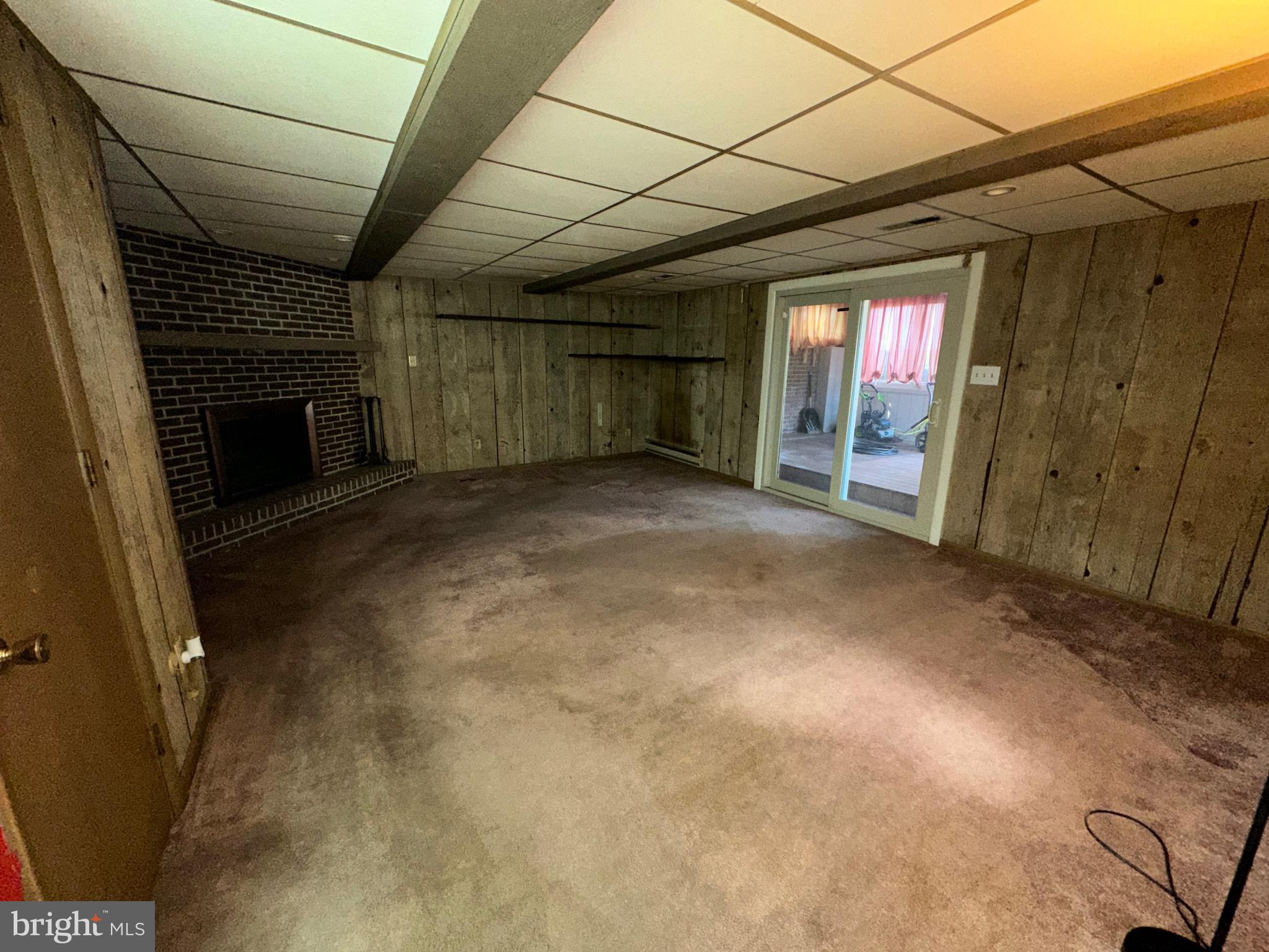 2776 Stevens Summit Drive Columbia, PA 17512 - Photo 23 of 39 a view of empty room with wooden floor and fireplace