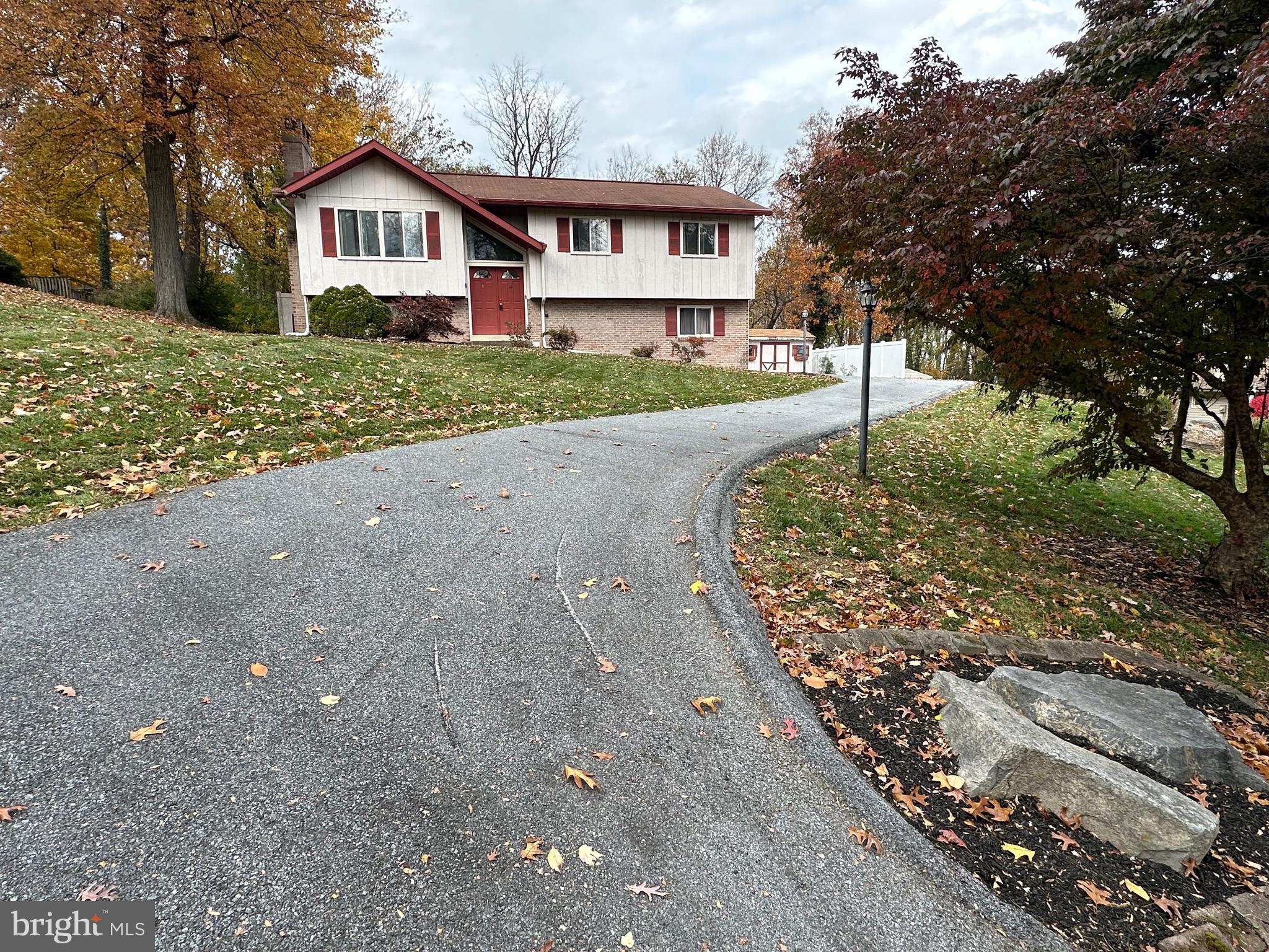 2776 Stevens Summit Drive Columbia, PA 17512 - Photo 3 of 39 a front view of a house with a yard and garage