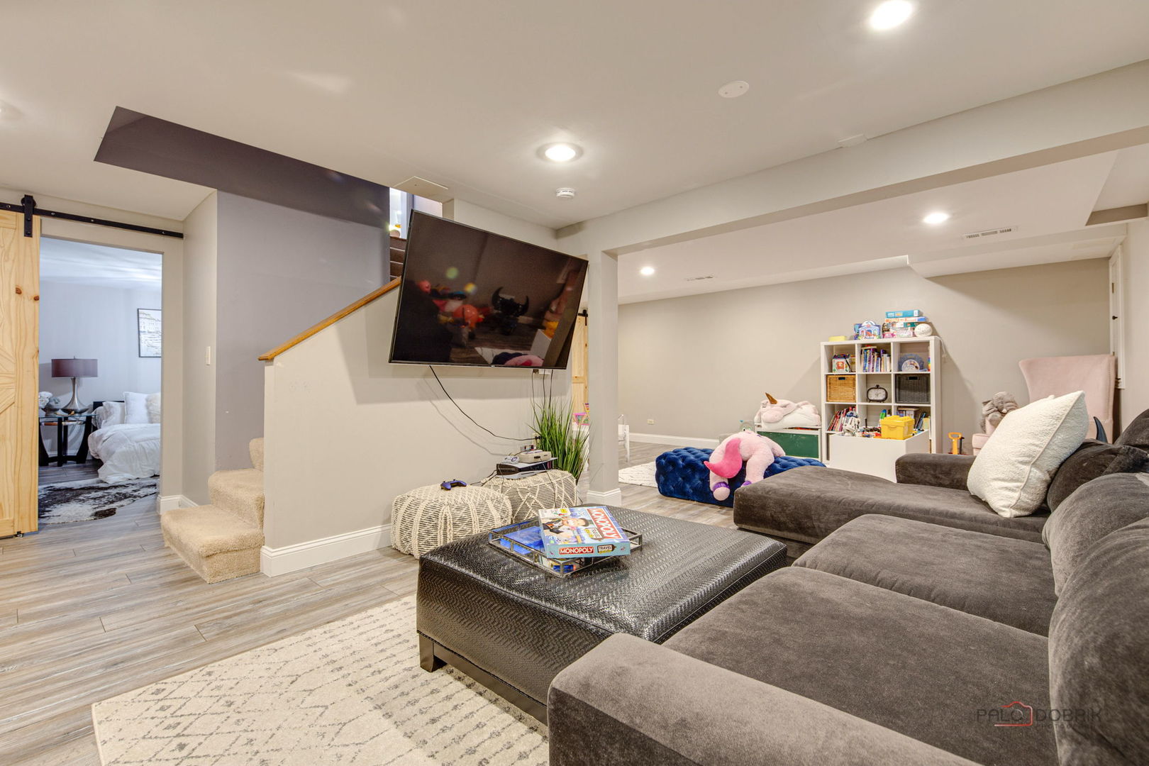 1930 Lisson Road Naperville, IL 60565 - Photo 21 of 32 a living room with furniture and a flat screen tv