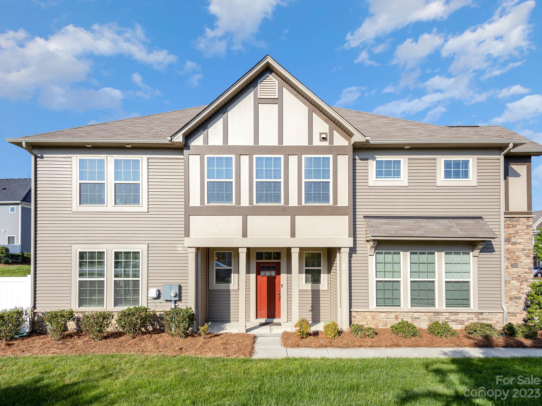 a front view of a house with a yard