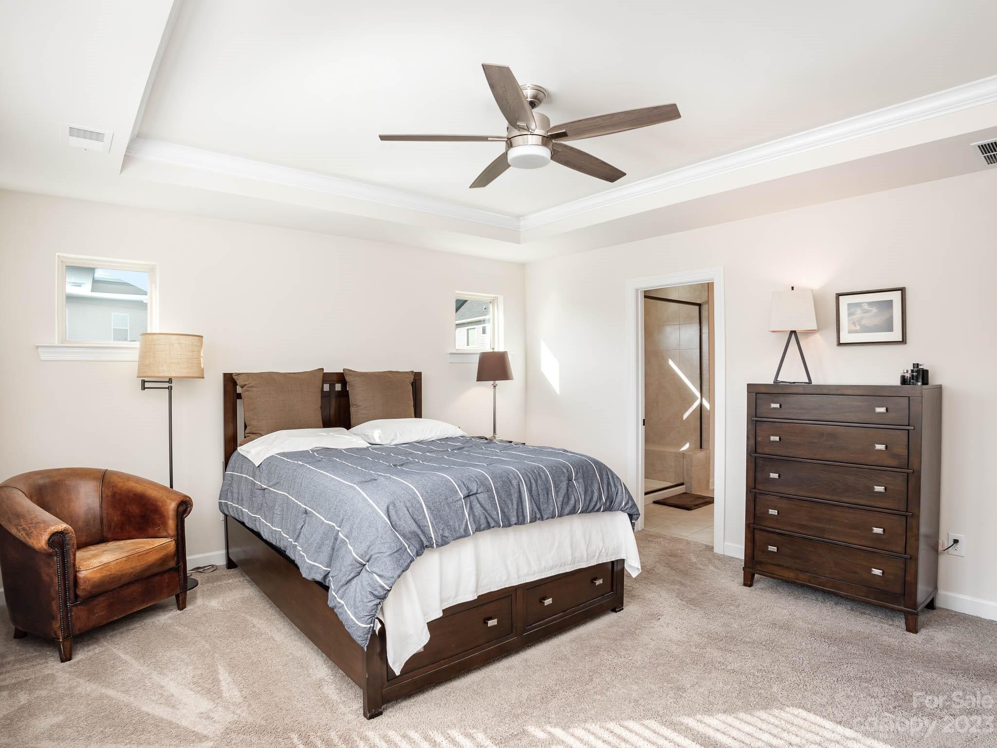 5688 Garrow Glen Road Charlotte, NC 28278 - Photo 12 of 30 a bedroom with a bed a couch and dresser