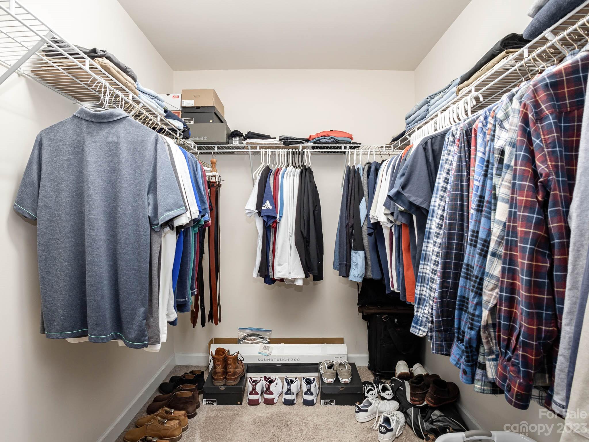 5688 Garrow Glen Road Charlotte, NC 28278 - Photo 16 of 30 a walk in closet with clothes