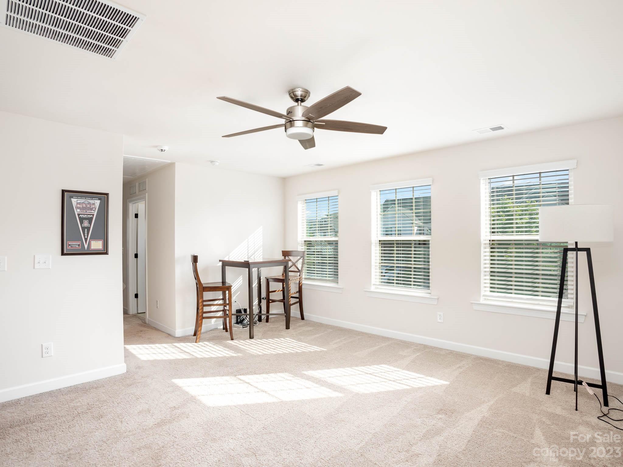 5688 Garrow Glen Road Charlotte, NC 28278 - Photo 18 of 30 a dining room with wooden floor and a window