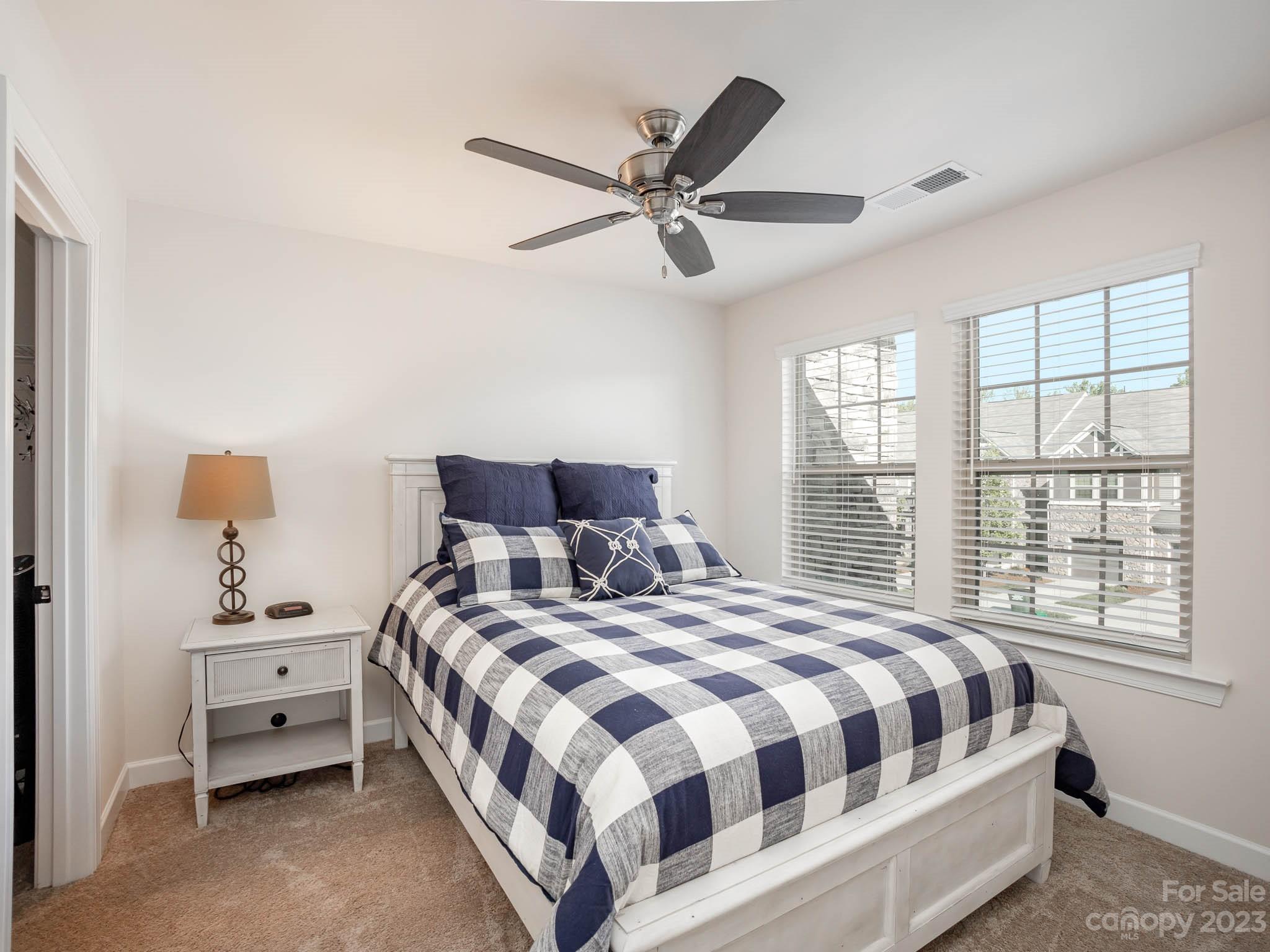 5688 Garrow Glen Road Charlotte, NC 28278 - Photo 20 of 30 a bedroom with bed and window