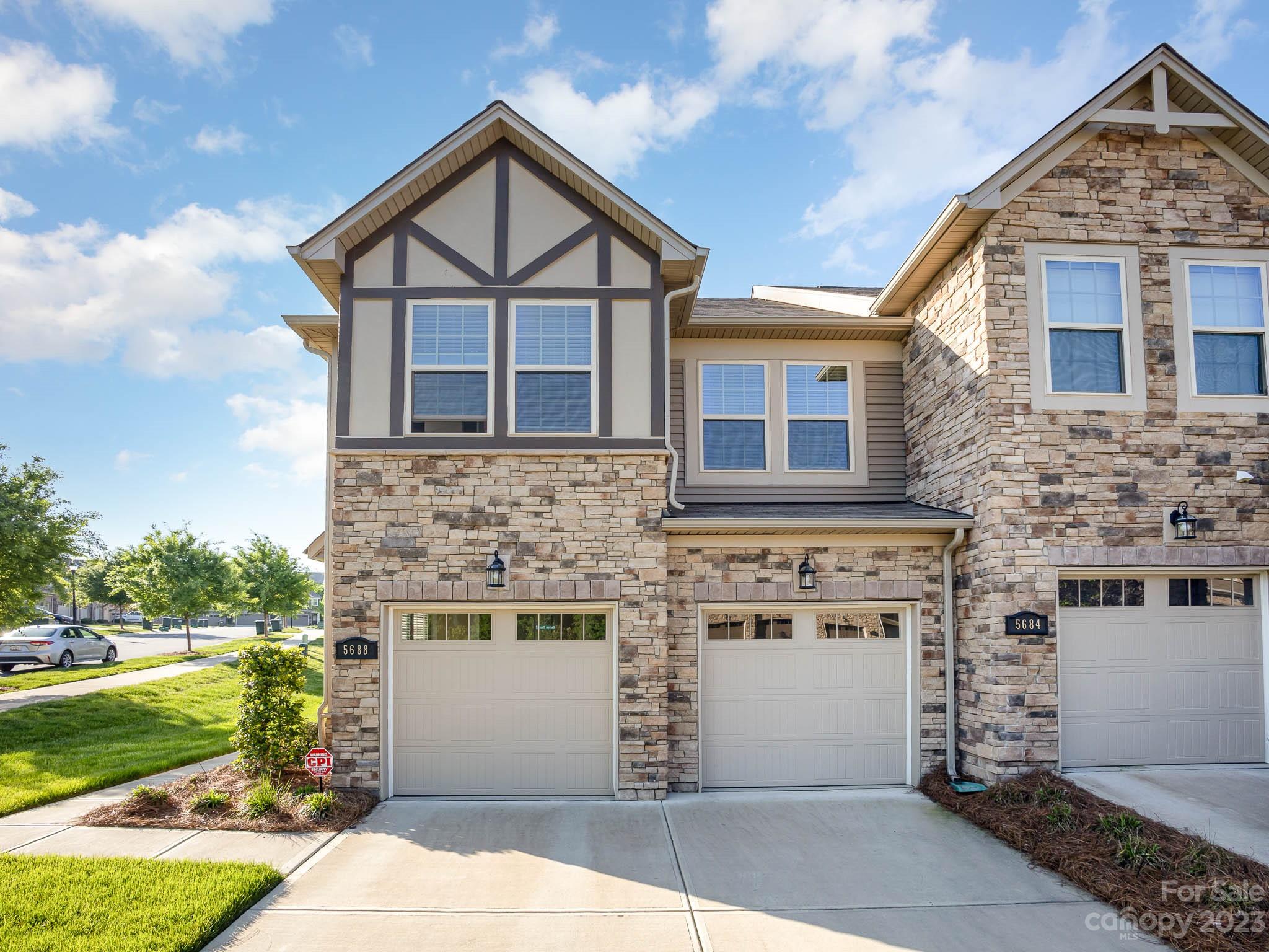 5688 Garrow Glen Road Charlotte, NC 28278 - Photo 2 of 30 a front view of a house with a yard