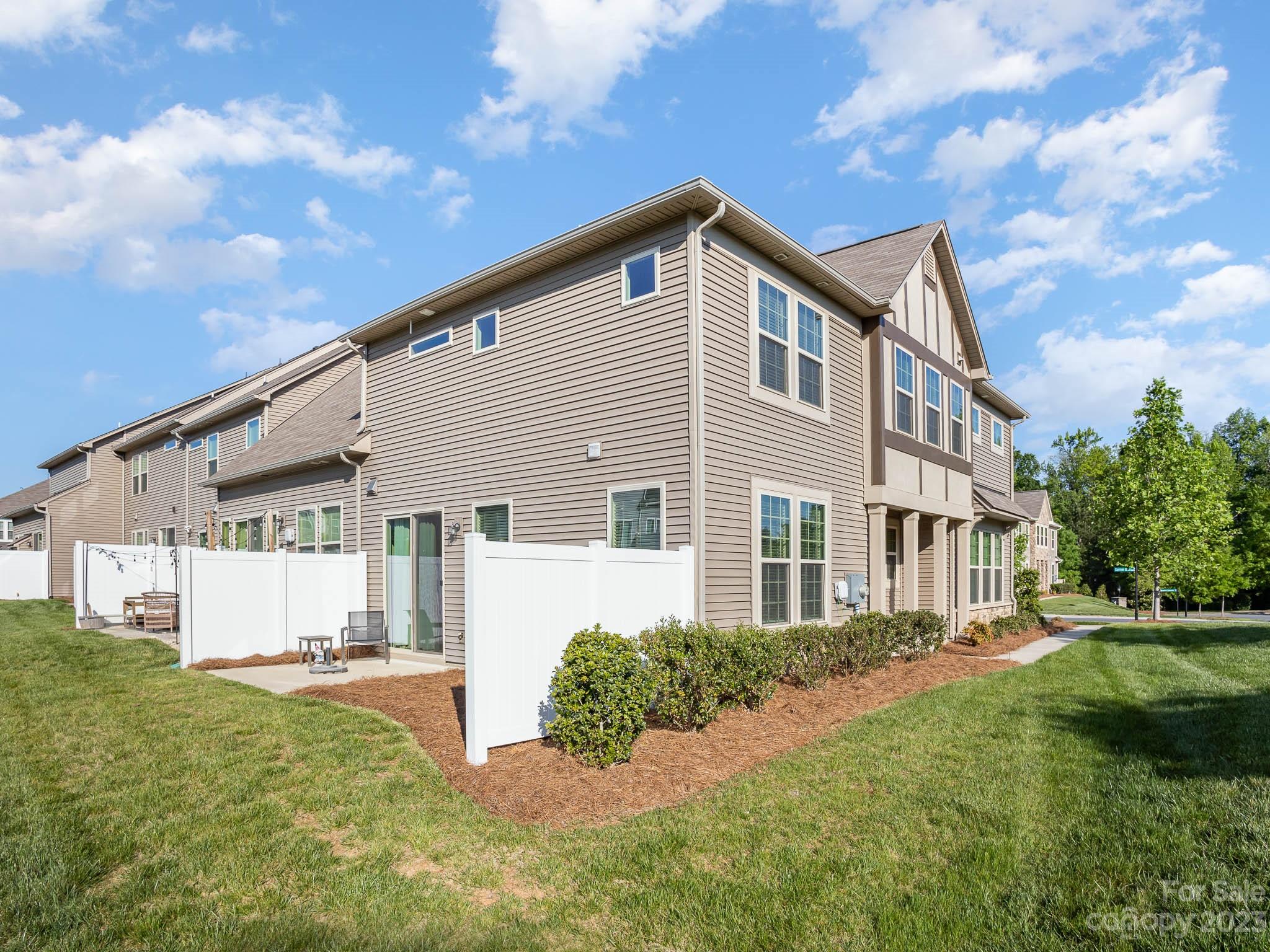 5688 Garrow Glen Road Charlotte, NC 28278 - Photo 23 of 30 a front view of a house with a yard