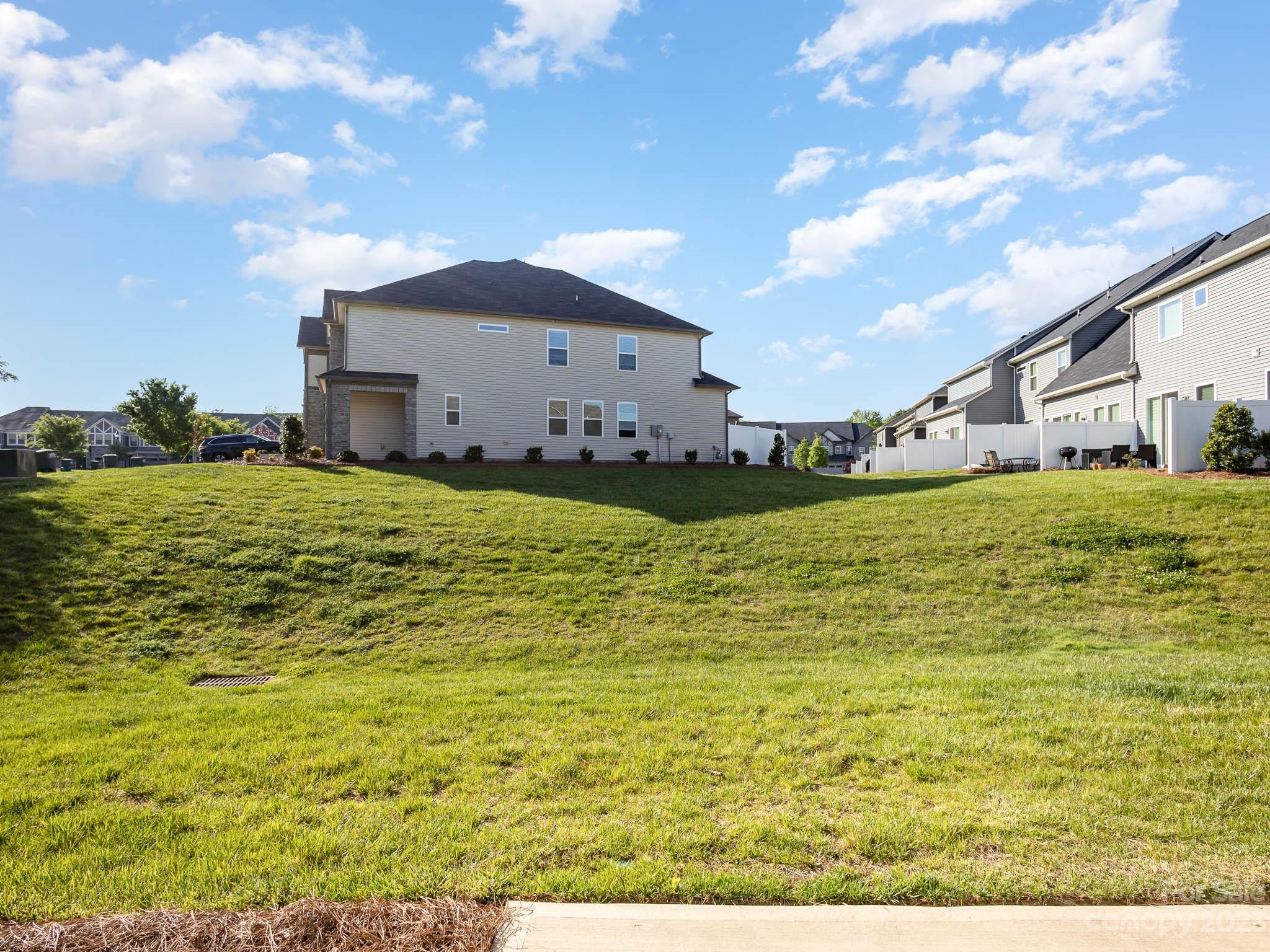 5688 Garrow Glen Road Charlotte, NC 28278 - Photo 25 of 30 a view of a house with a yard