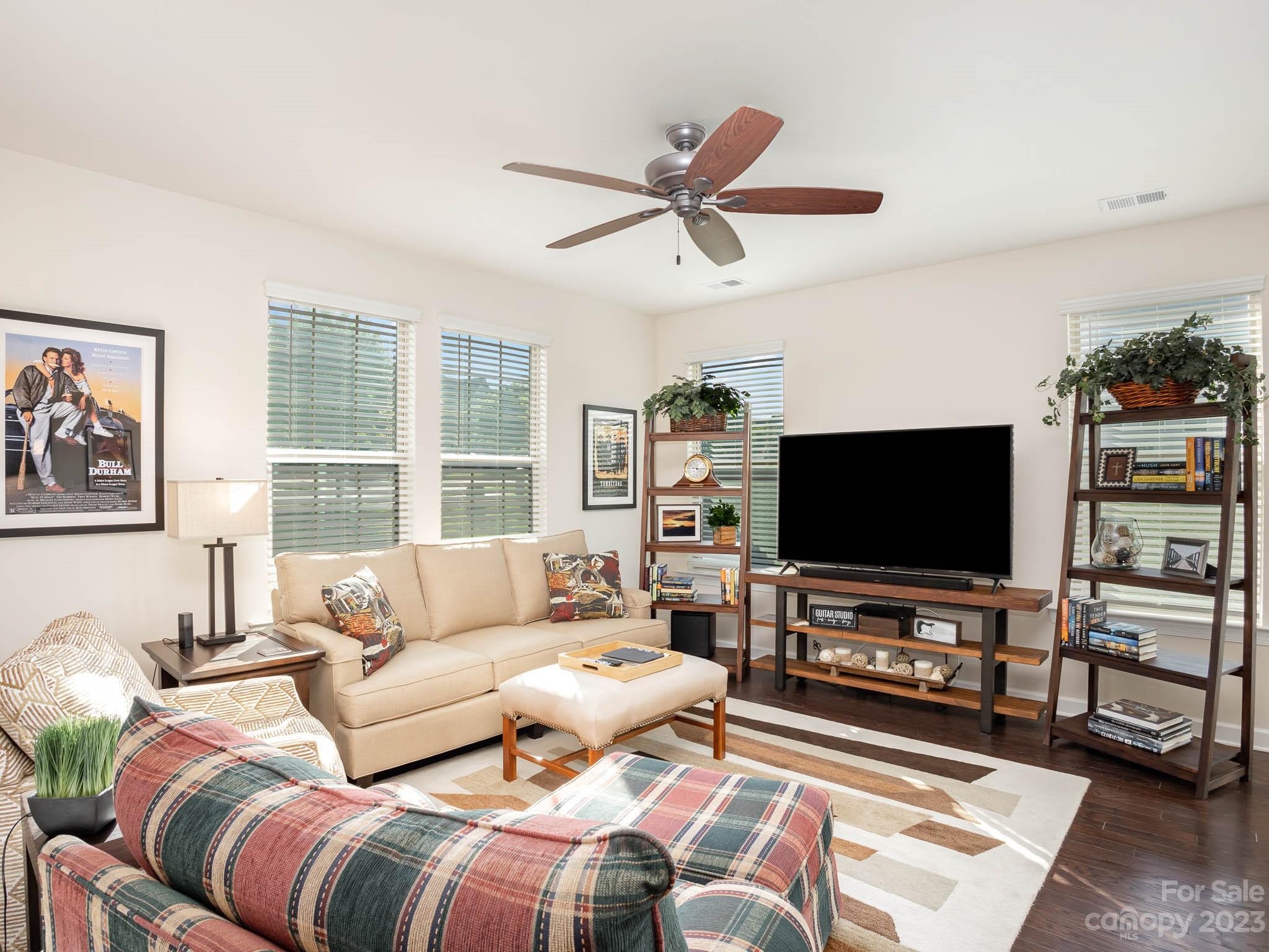 5688 Garrow Glen Road Charlotte, NC 28278 - Photo 8 of 30 a living room with furniture and a flat screen tv