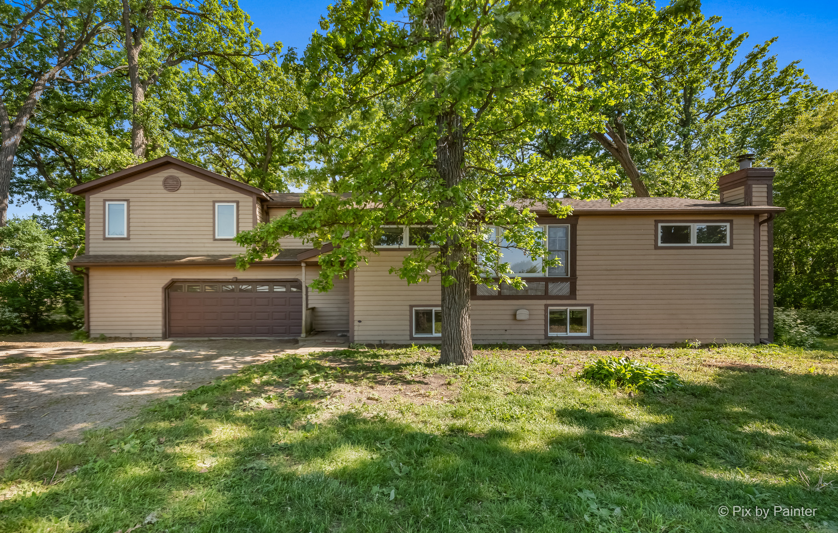 45W447 Lees Road Maple Park, IL 60151 - Photo 1 of 37 a house with a tree in front of it