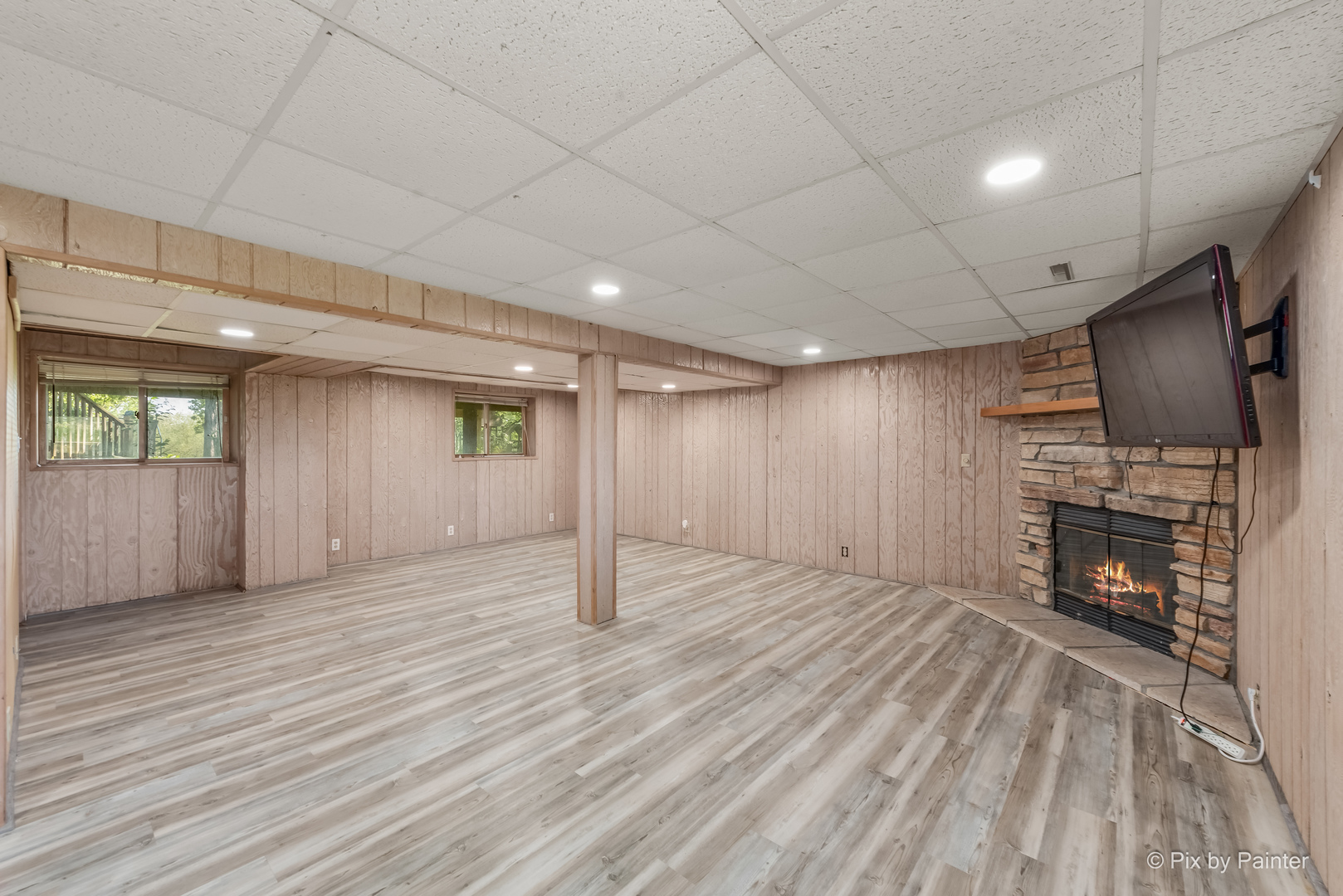 45W447 Lees Road Maple Park, IL 60151 - Photo 22 of 37 an empty room with wooden floor fireplace and windows