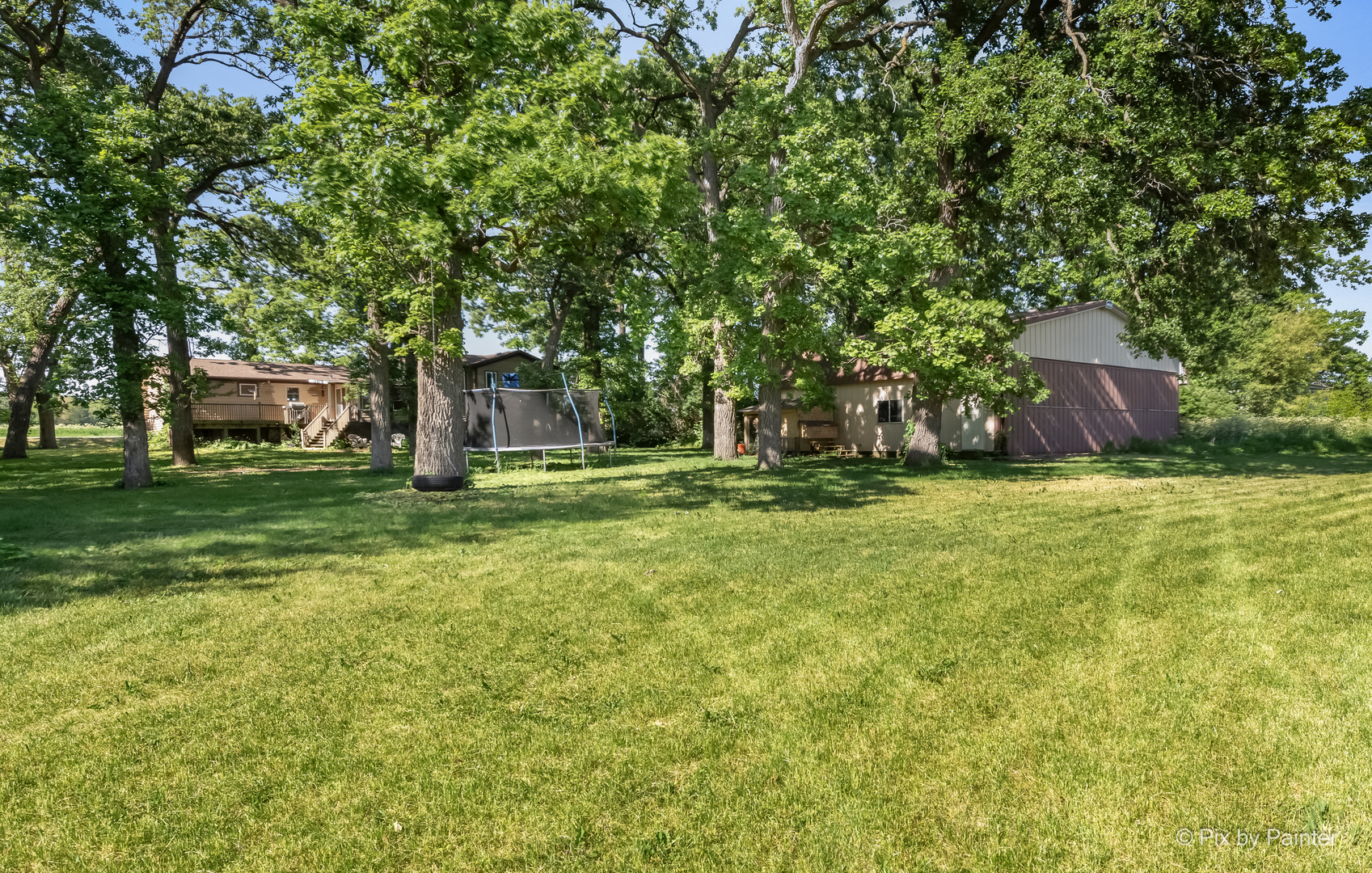 45W447 Lees Road Maple Park, IL 60151 - Photo 33 of 37 a view of a backyard with a garden and trees