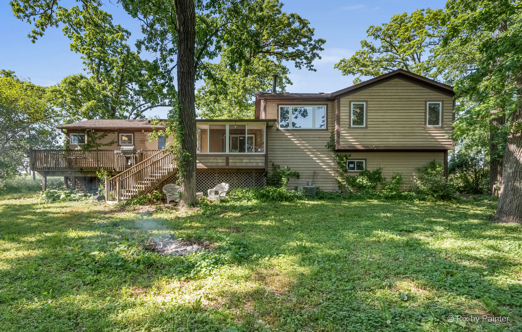 45W447 Lees Road Maple Park, IL 60151 - Photo 36 of 37 a view of a yard in front of a house with plants and large tree