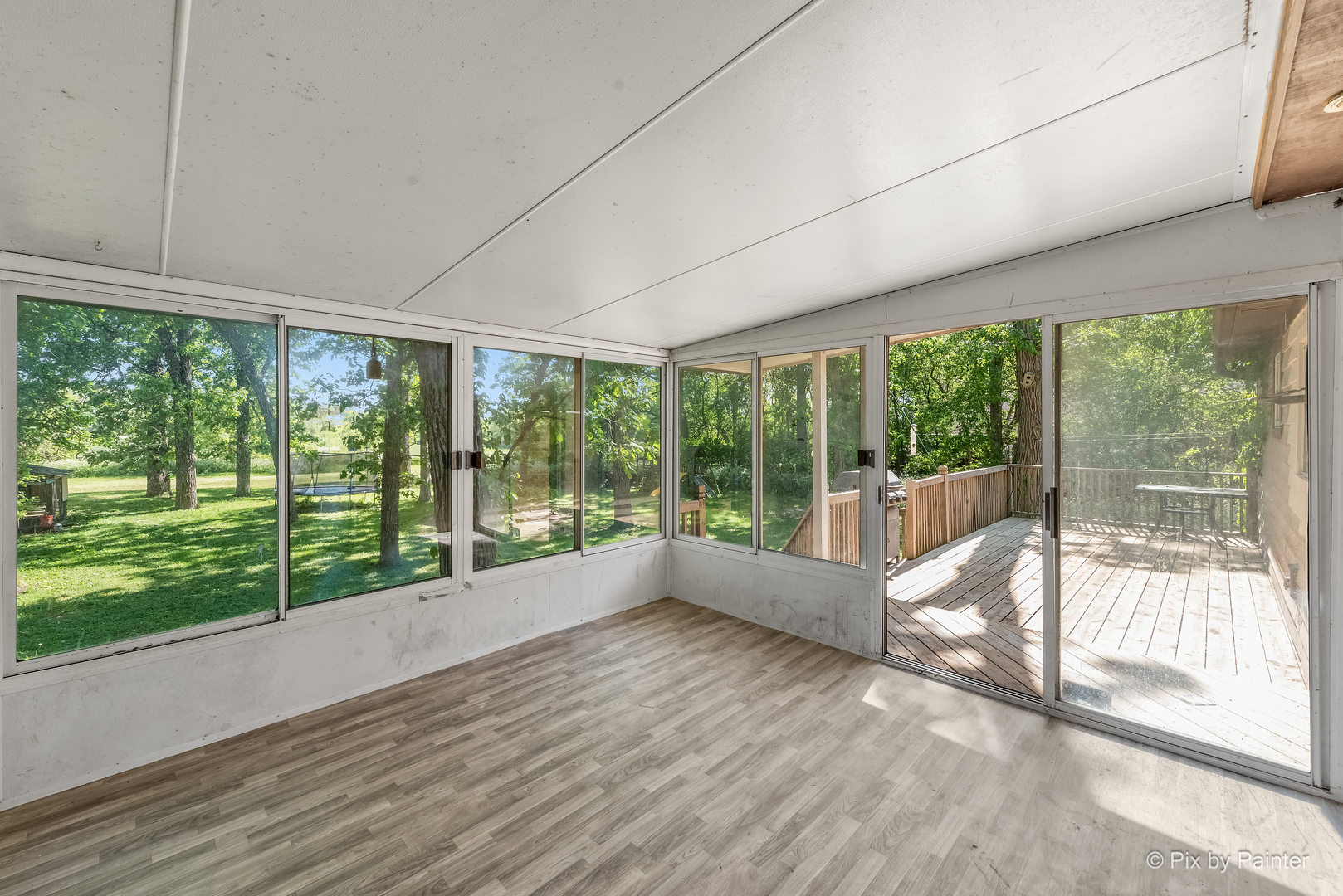 45W447 Lees Road Maple Park, IL 60151 - Photo 8 of 37 a view of an empty room with wooden floor and a large window with outer view