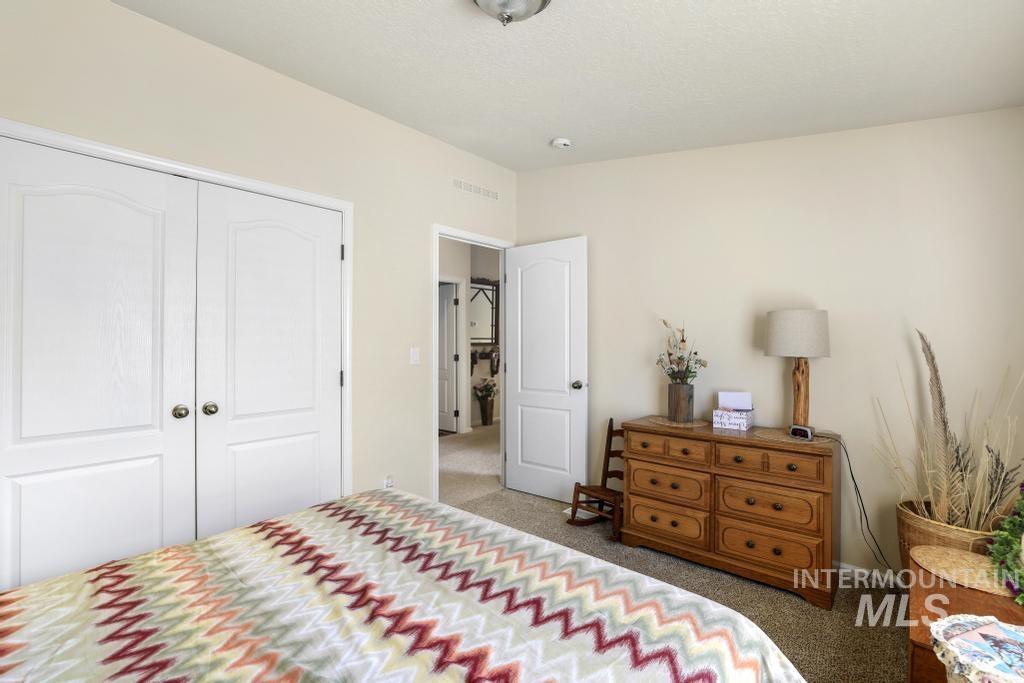 910 Moonglo Road, Unit 14 Buhl, ID 83316 - Photo 16 of 22 Carpeted bedroom featuring a closet