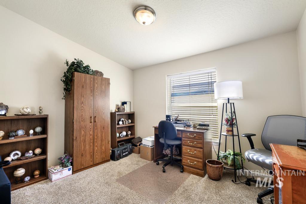 910 Moonglo Road, Unit 14 Buhl, ID 83316 - Photo 18 of 22 Office area featuring light carpet and a textured ceiling