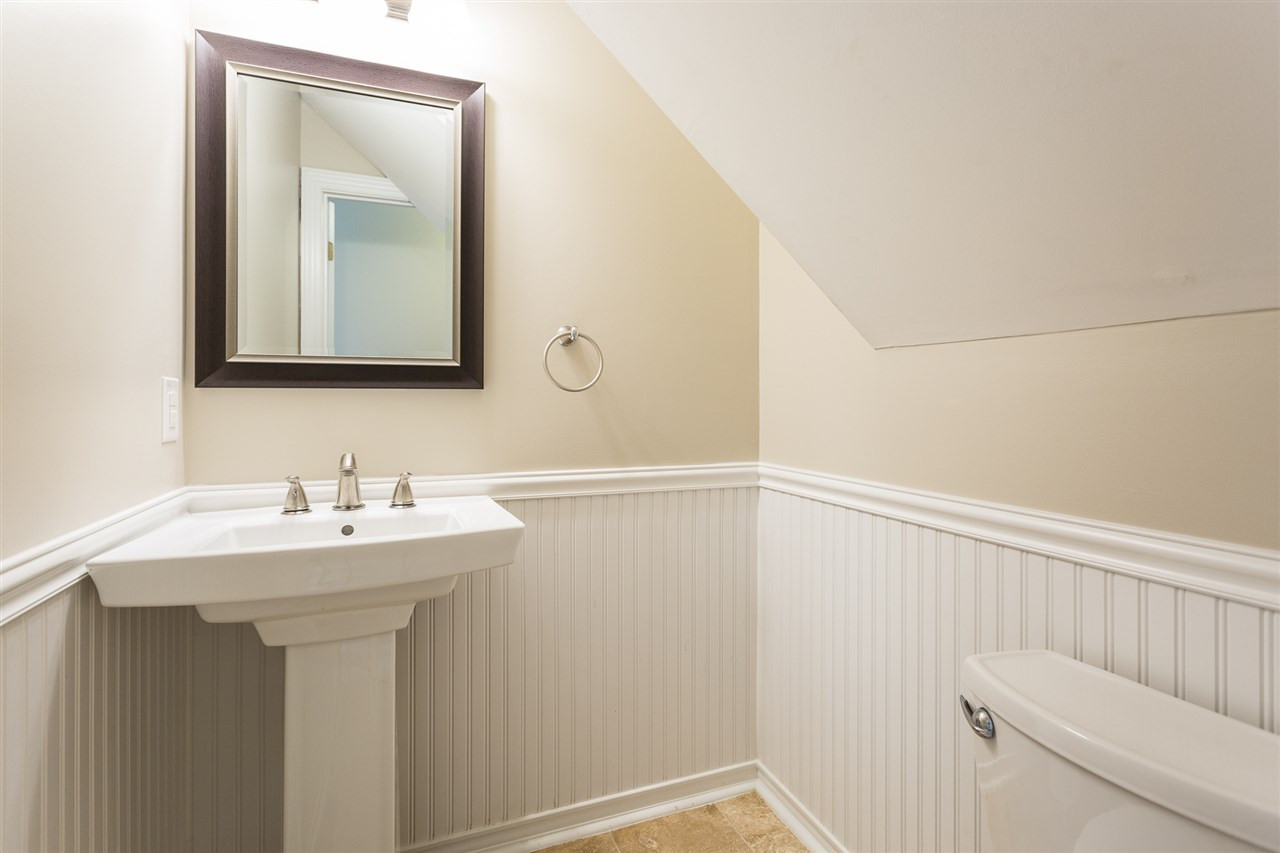 8805 Life Lane Raleigh, NC 27615 - Photo 16 of 28 Great space with beadboard and updated pedestal sink First floor half bath