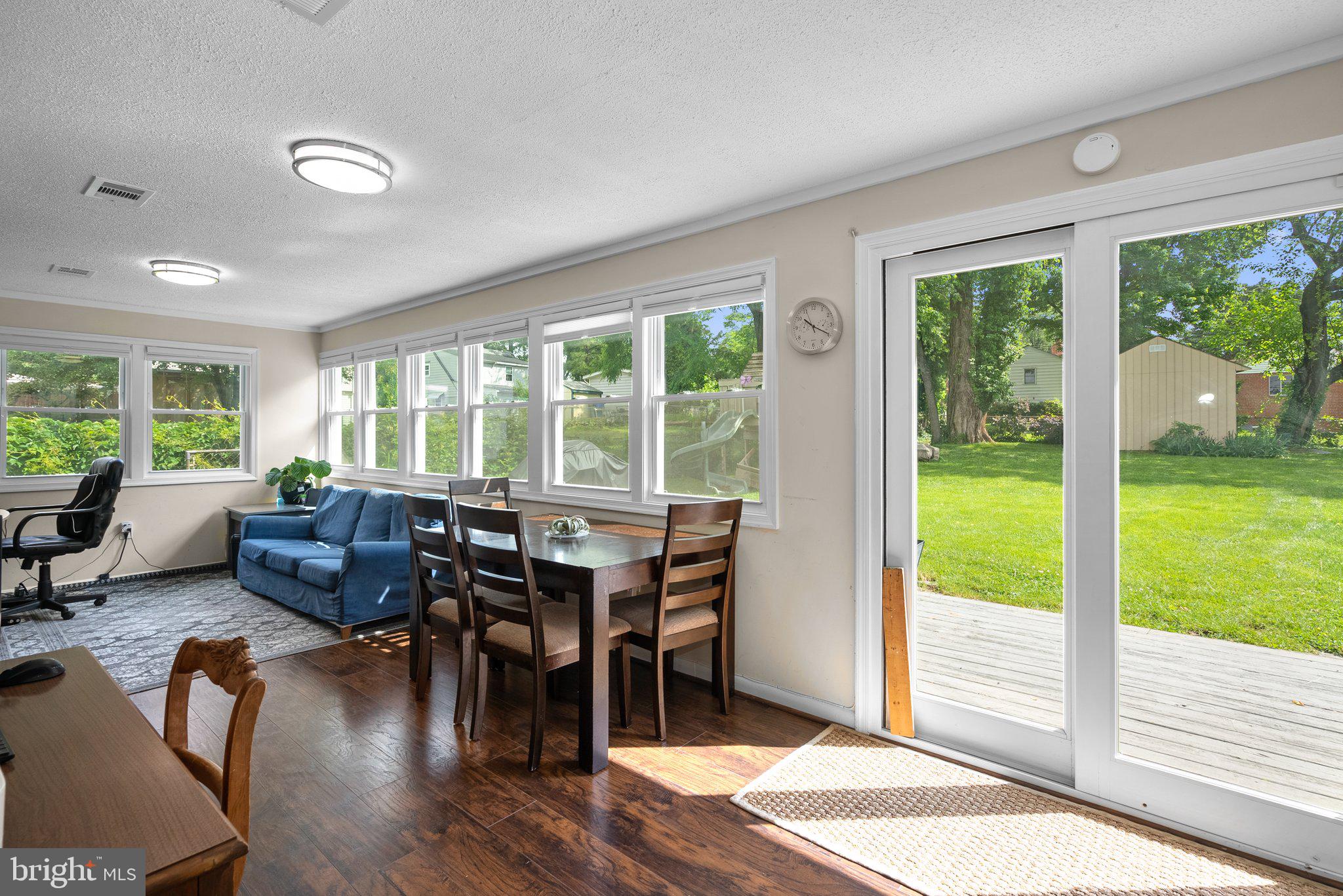 12837 Flack Street Silver Spring, MD 20906 - Photo 11 of 26 a living room with furniture and a large window with outer view